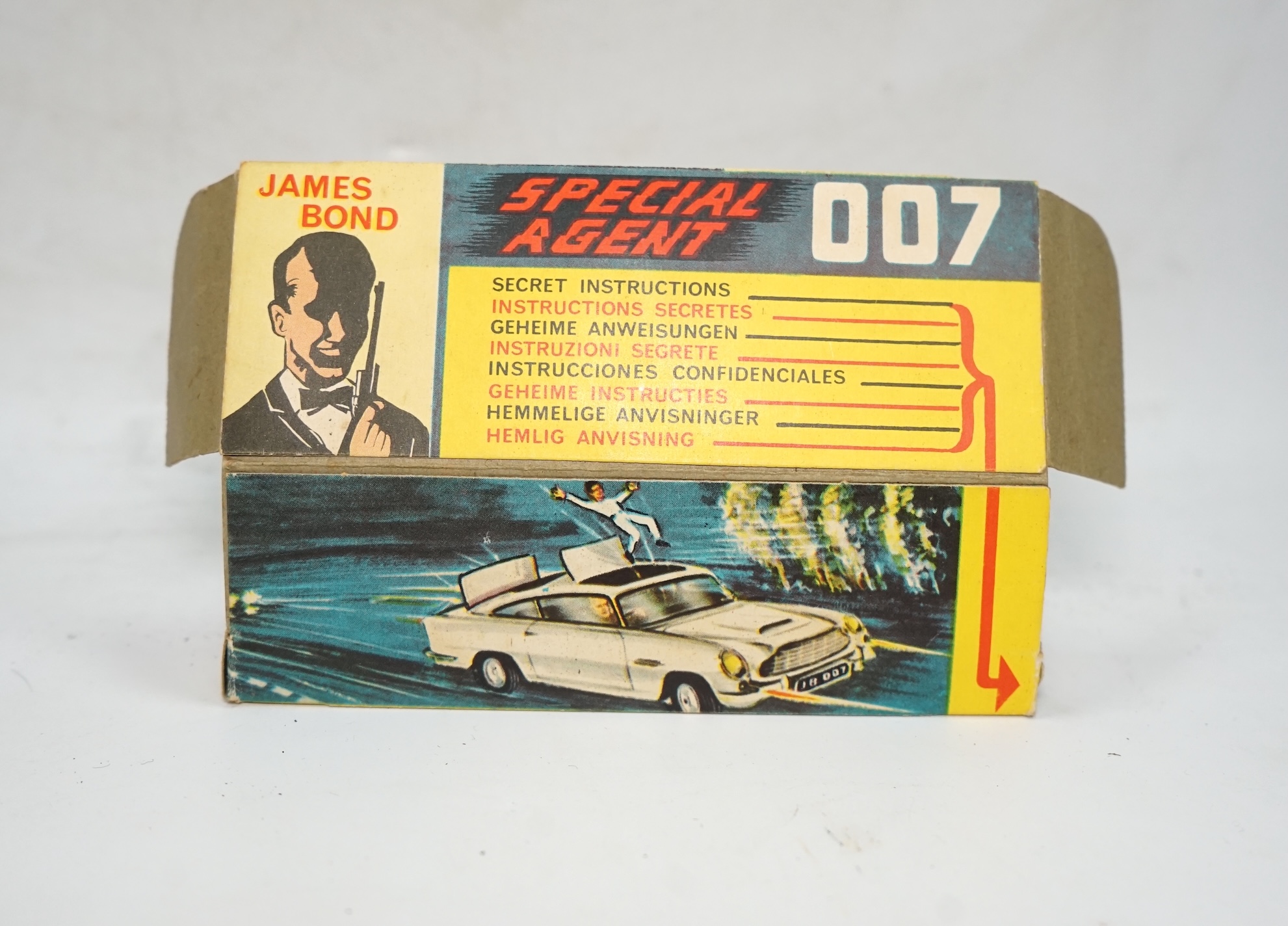 A boxed Corgi Toys James Bond 007 Aston Martin DB5 (261), a gold Aston Martin, with inner display stand, the envelope for the secret instructions (contents missing), the correct James Bond advertising leaflet and two pas